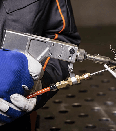 the correct posture for holding a laser welding gun