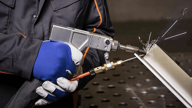 The correct posture for holding a laser welding gun.