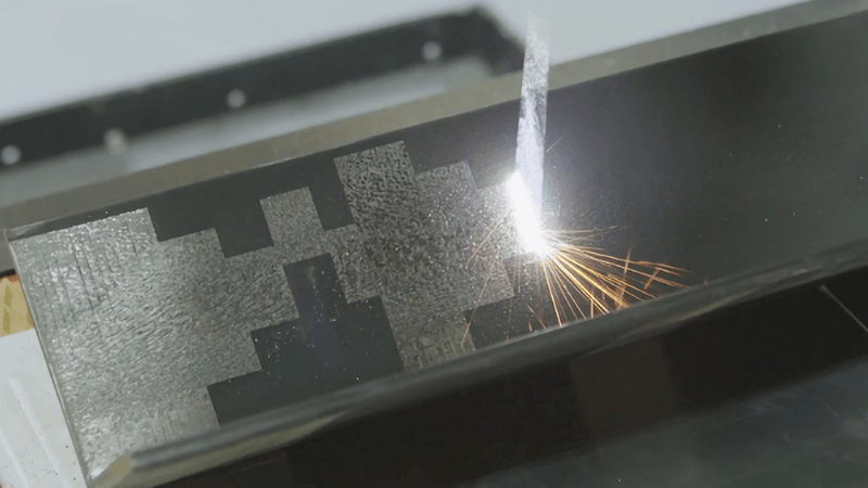 Laser cleaning of coating on metal surface