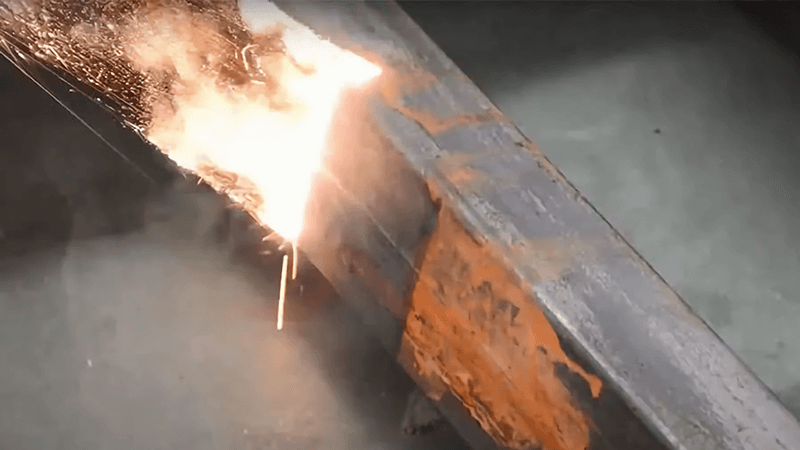 Laser cleaning of rust on steel pipe